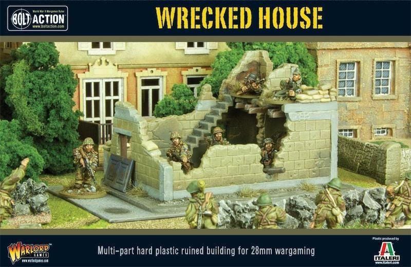 Wrecked house diorama with soldiers enhances tactical gameplay for Bolt Action tabletop wargame.